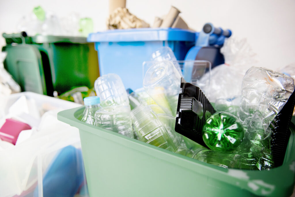 Used plastic bottles in recycling bins for earth day campaign