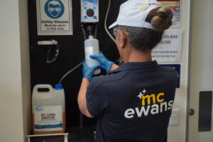 Lady refilling hygiene consumables | Mcewanscleaning